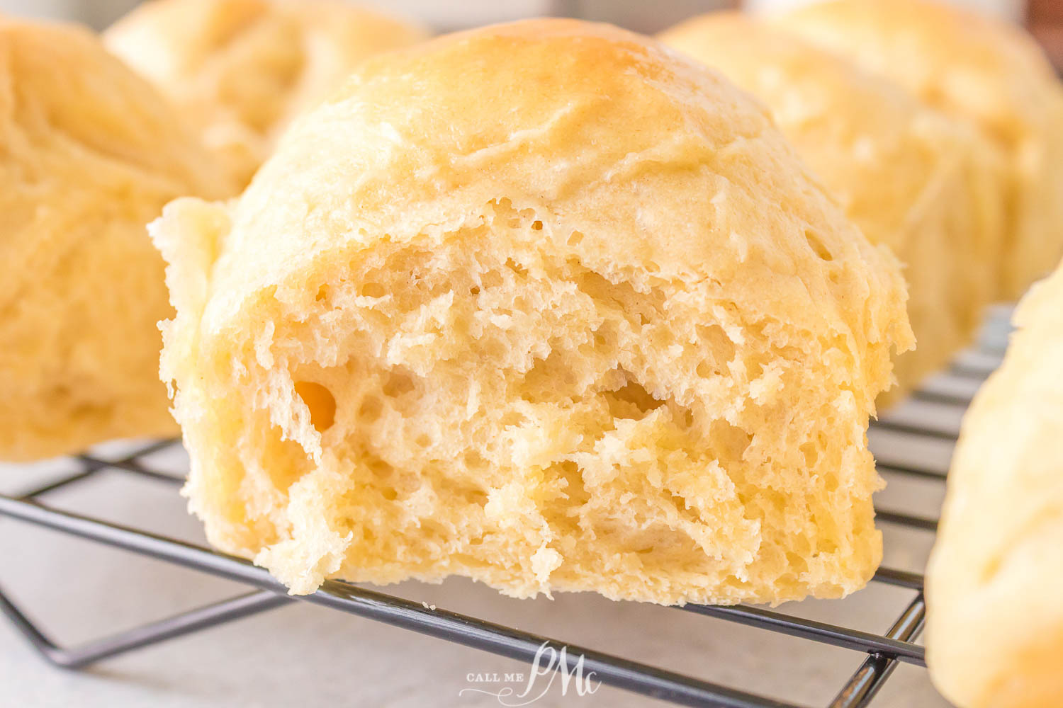 Sourdough Dinner Rolls on a cooling rack.